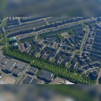 Luchtfoto gezien vanaf het westen van de buurt De Bouwen in 2019 met onderin bedrijventerrein De Schaft met diagonaal de groenstrook De Vijfwal. Foto: Slagboom en Peeters Luchtfotografie B.V..